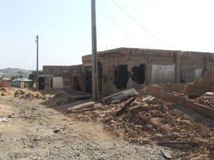 Kabiru's house among the 2008 ruins